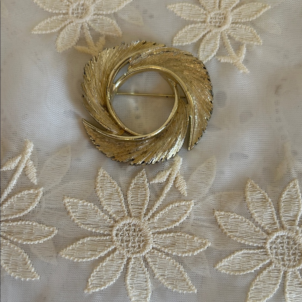 Elegant Gold-Tone Swirl Brooch